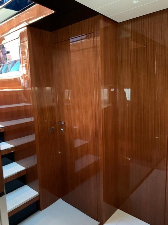 a wooden door in a room aboard 2020 RIVA 66 RIBELLE Yacht for Sale