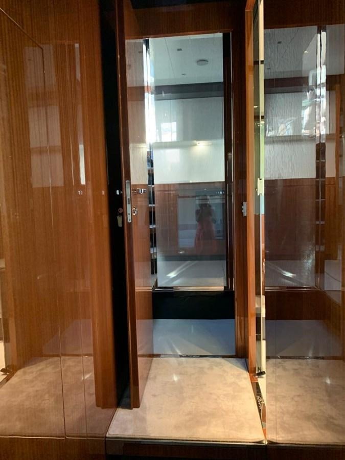 a glass door with a glass door aboard 2020 RIVA 66 RIBELLE Yacht for Sale