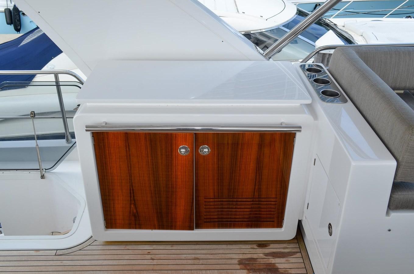 a wooden cabinet on a boat aboard CERULEAN Yacht for Sale