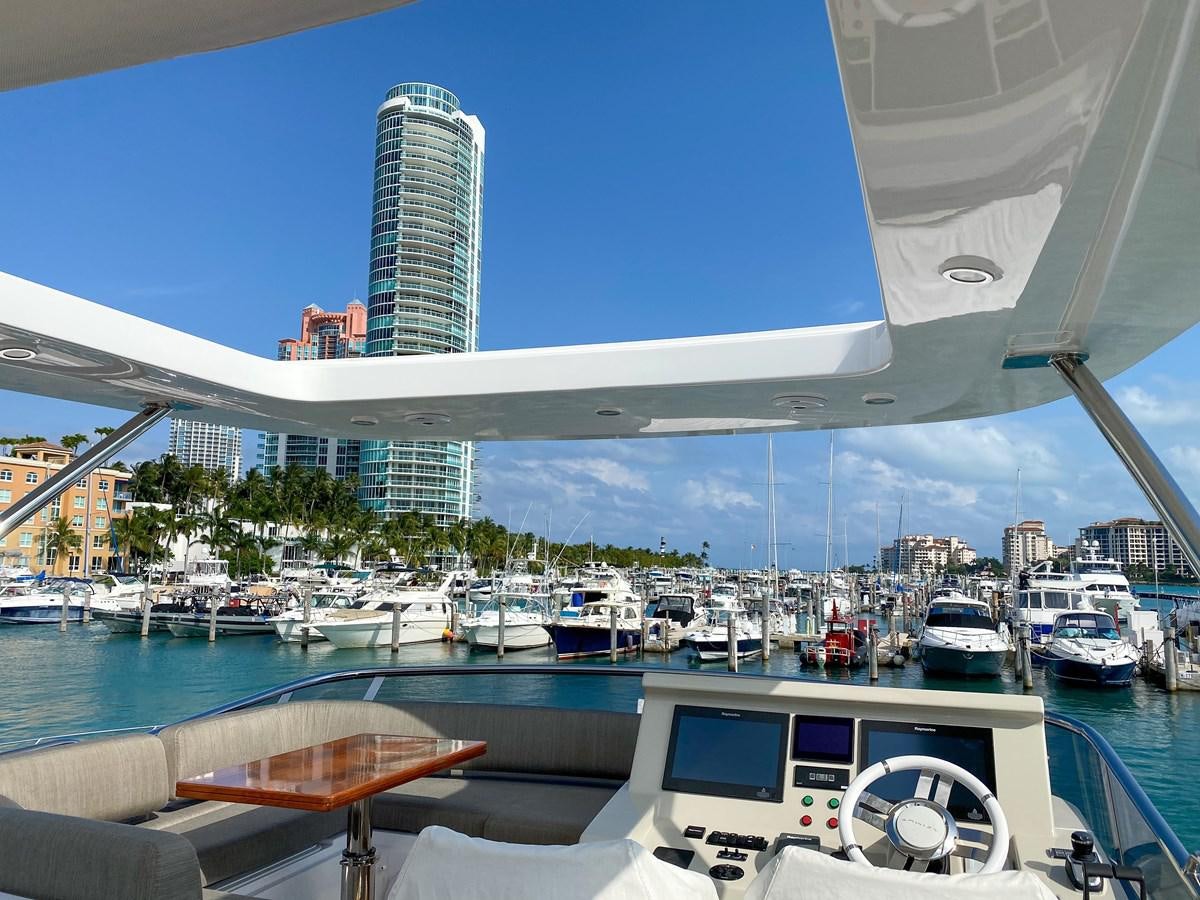 a large building with a bridge over it and boats in the water aboard CERULEAN Yacht for Sale