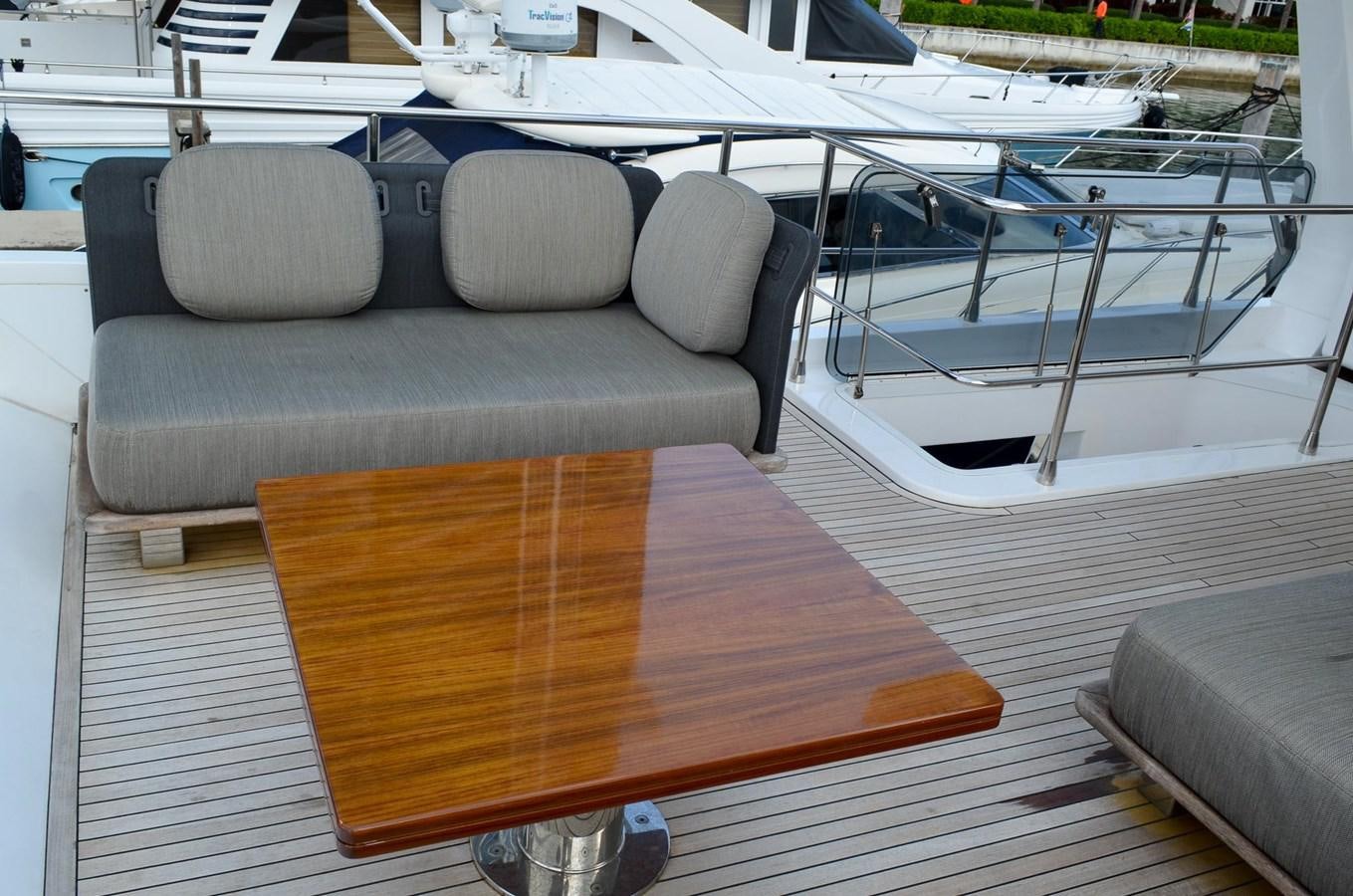 a chair next to a table aboard CERULEAN Yacht for Sale