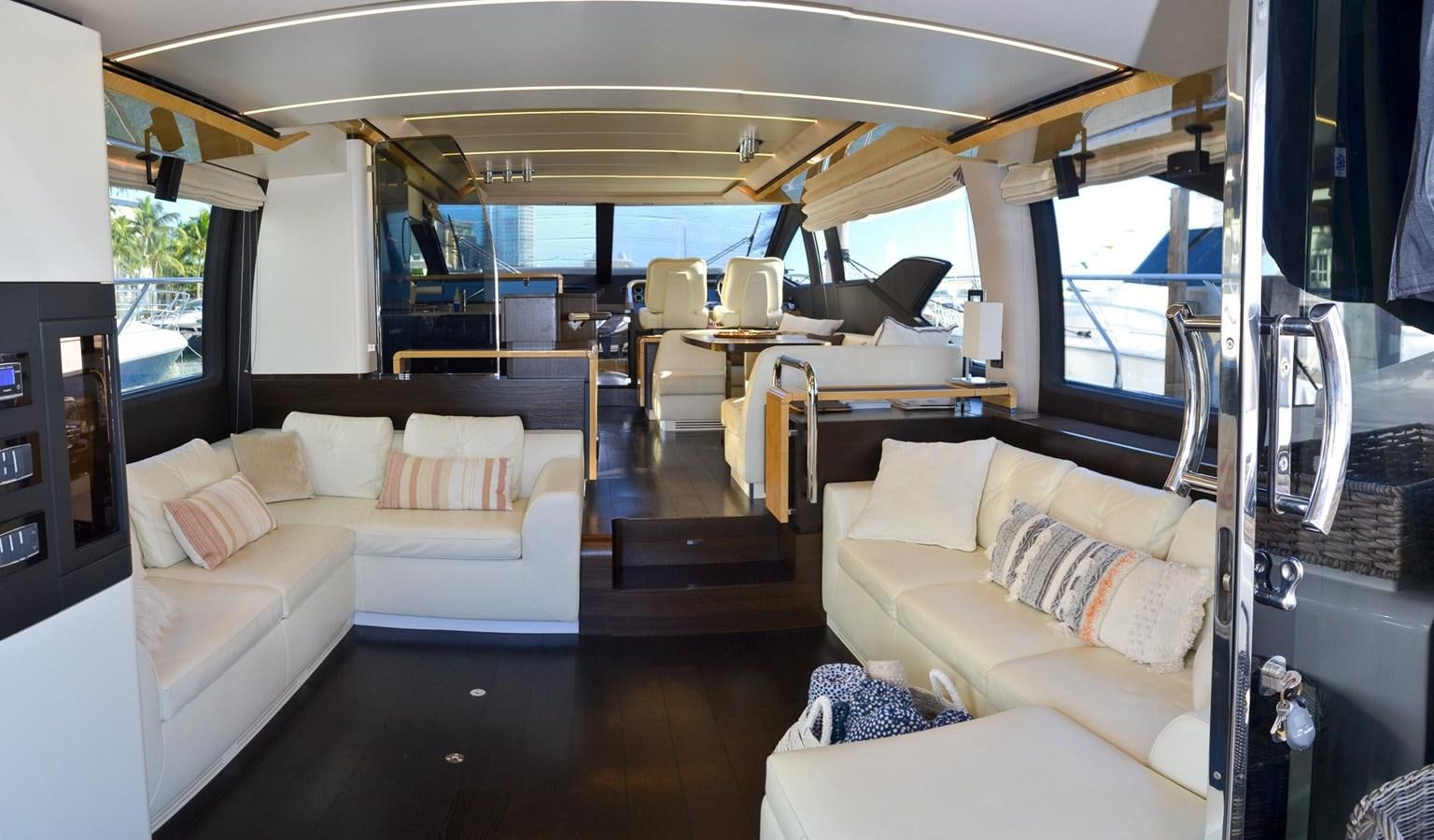 a living room with a couch and a table aboard CERULEAN Yacht for Sale