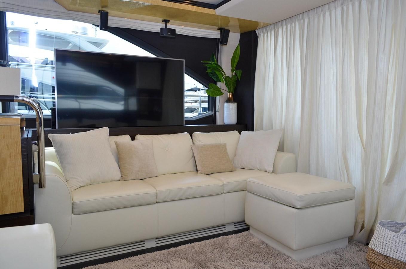 a white couch in a room aboard CERULEAN Yacht for Sale