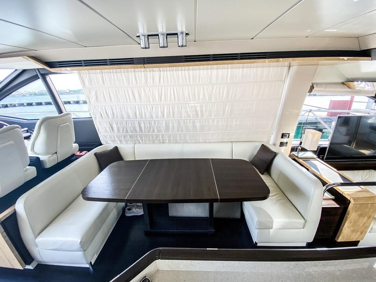 inside of a vehicle with a table and chairs aboard CERULEAN Yacht for Sale