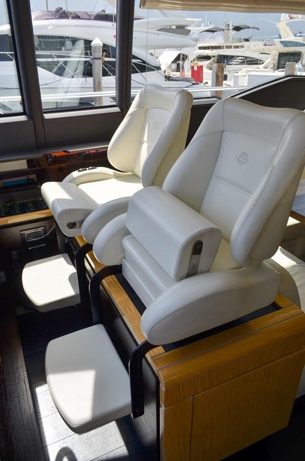 a room with chairs and tables aboard CERULEAN Yacht for Sale