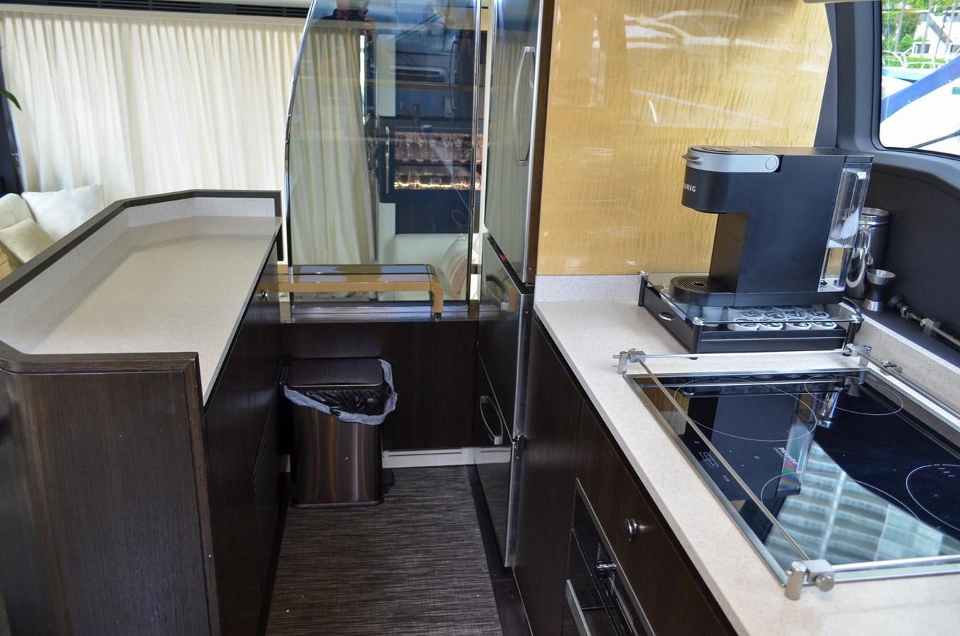 a kitchen with a stove and a sink aboard CERULEAN Yacht for Sale