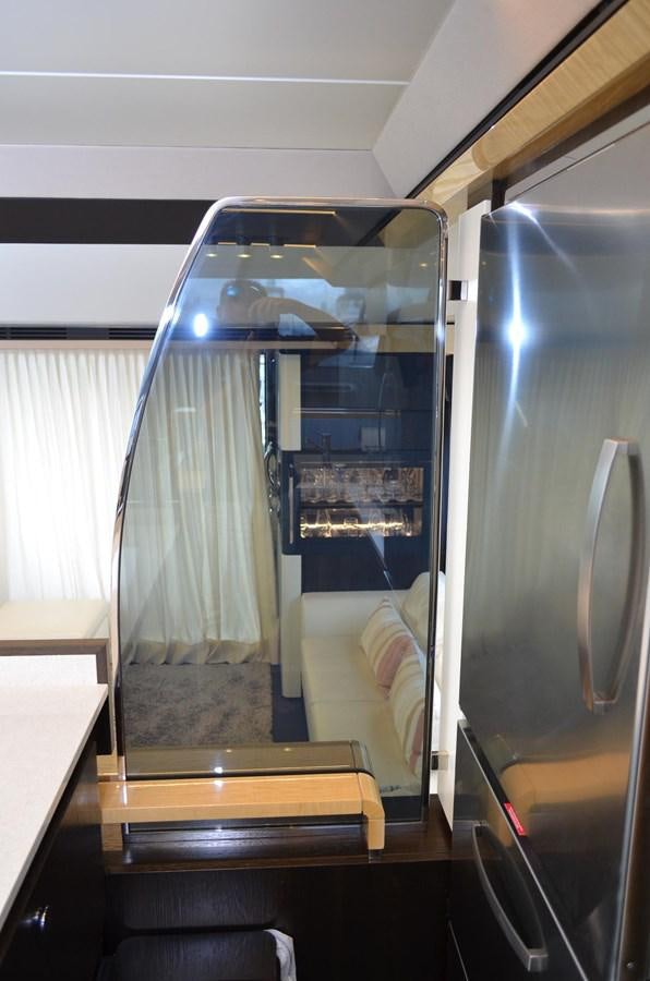 a room with a bed and a desk aboard CERULEAN Yacht for Sale