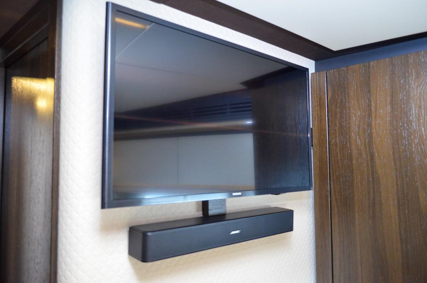 a large television screen aboard CERULEAN Yacht for Sale
