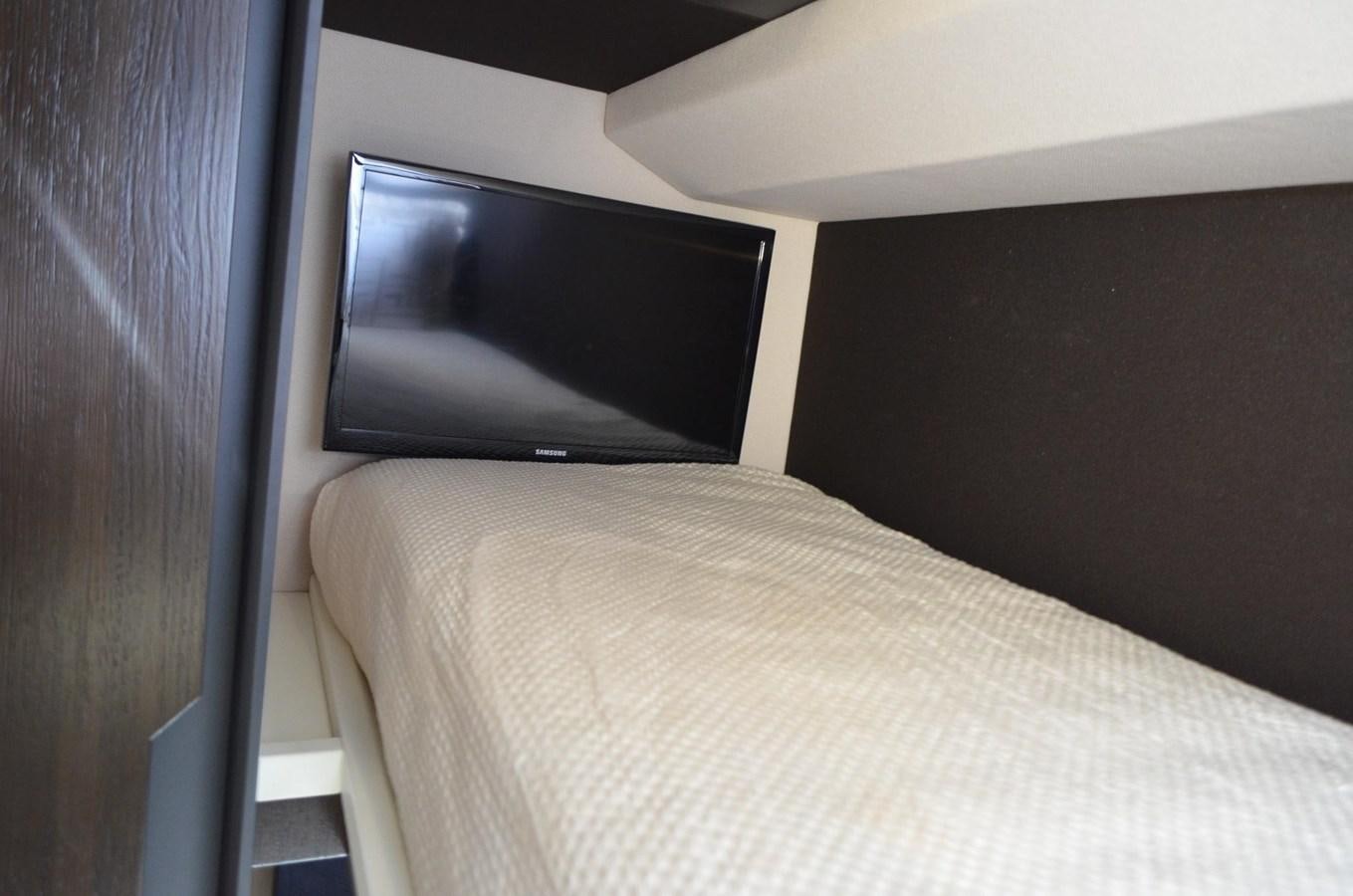 a television on a wall aboard CERULEAN Yacht for Sale