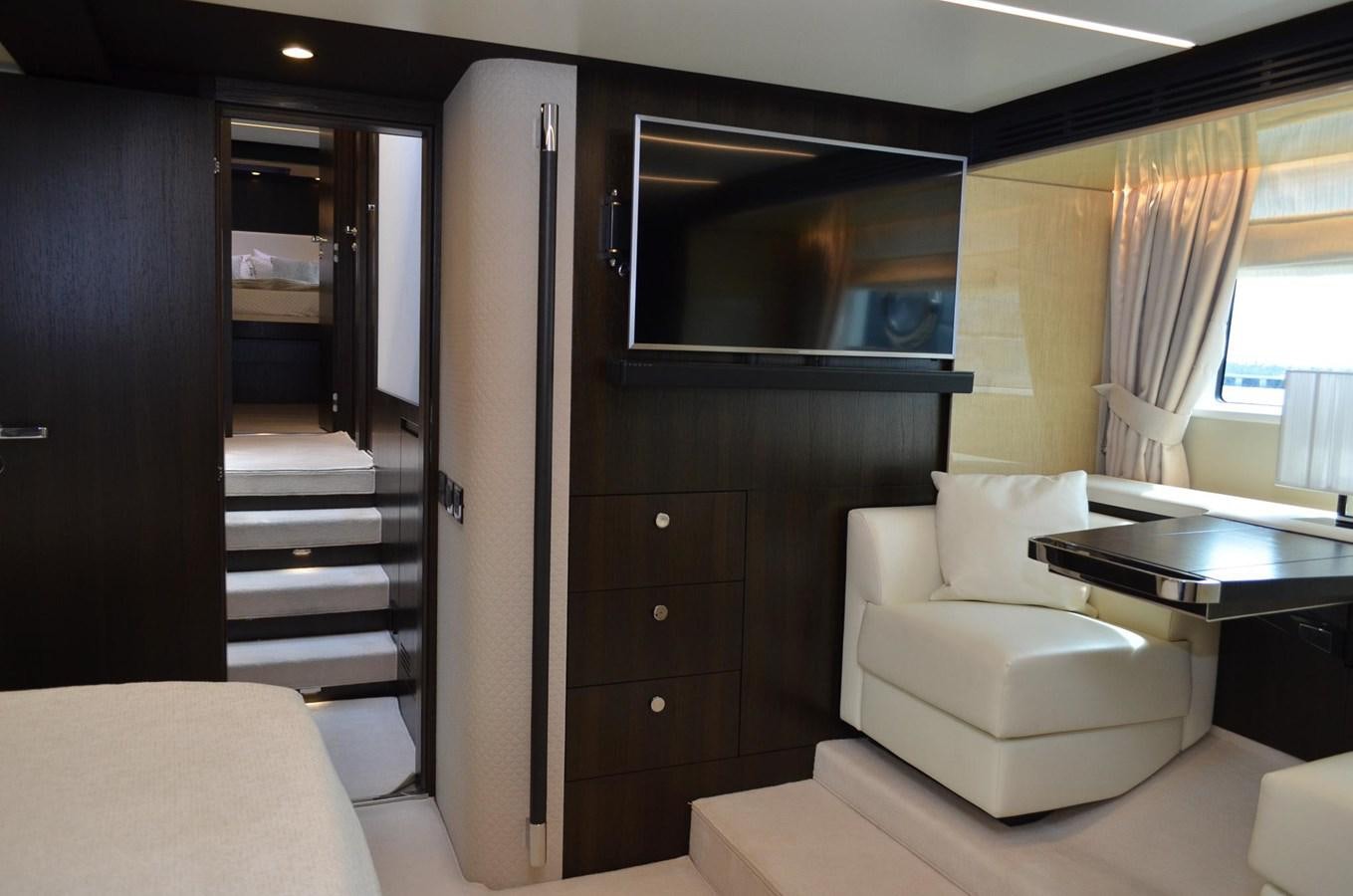 a room with a tv and a couch aboard CERULEAN Yacht for Sale