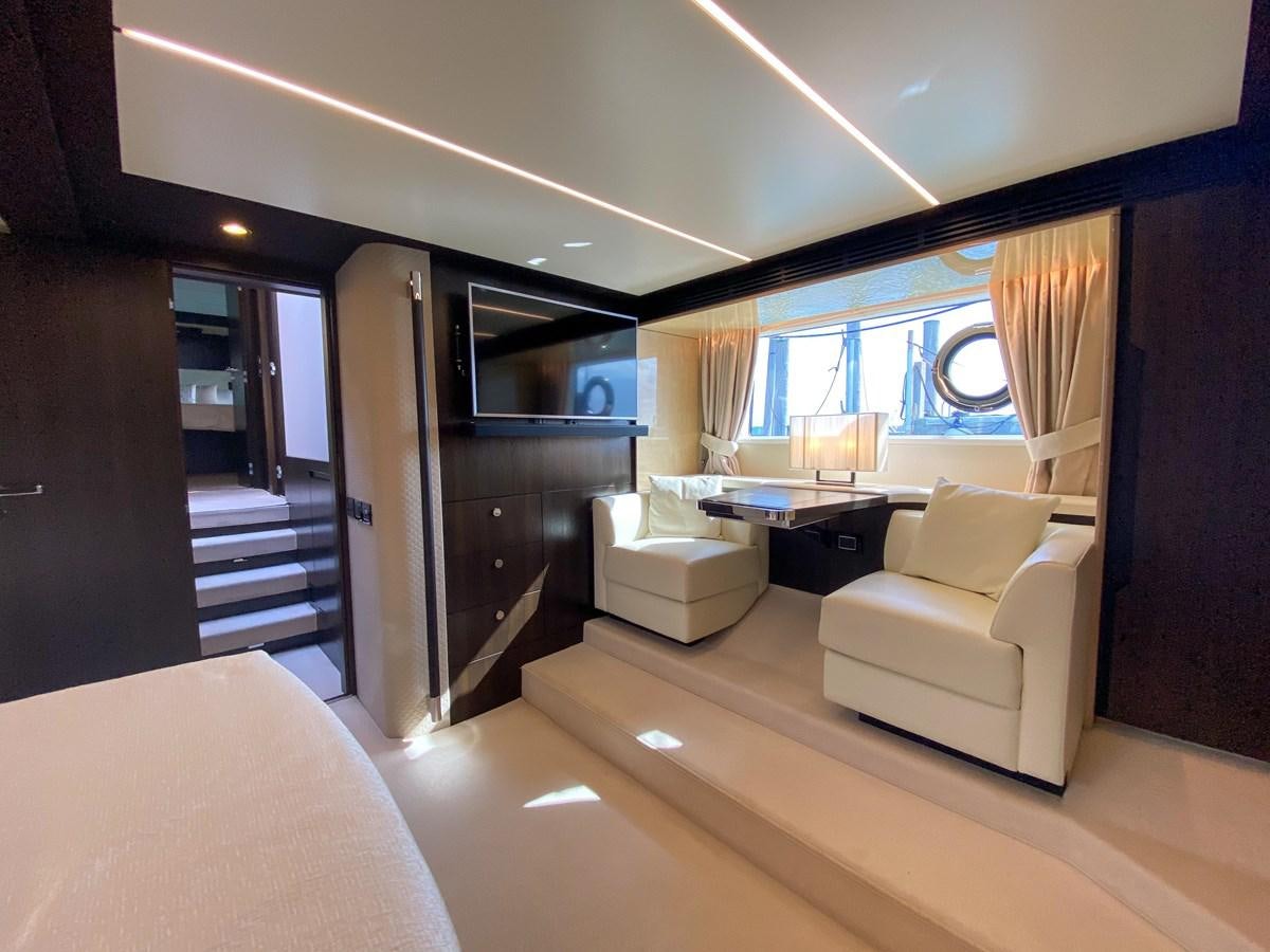 a room with a bed and a desk aboard CERULEAN Yacht for Sale