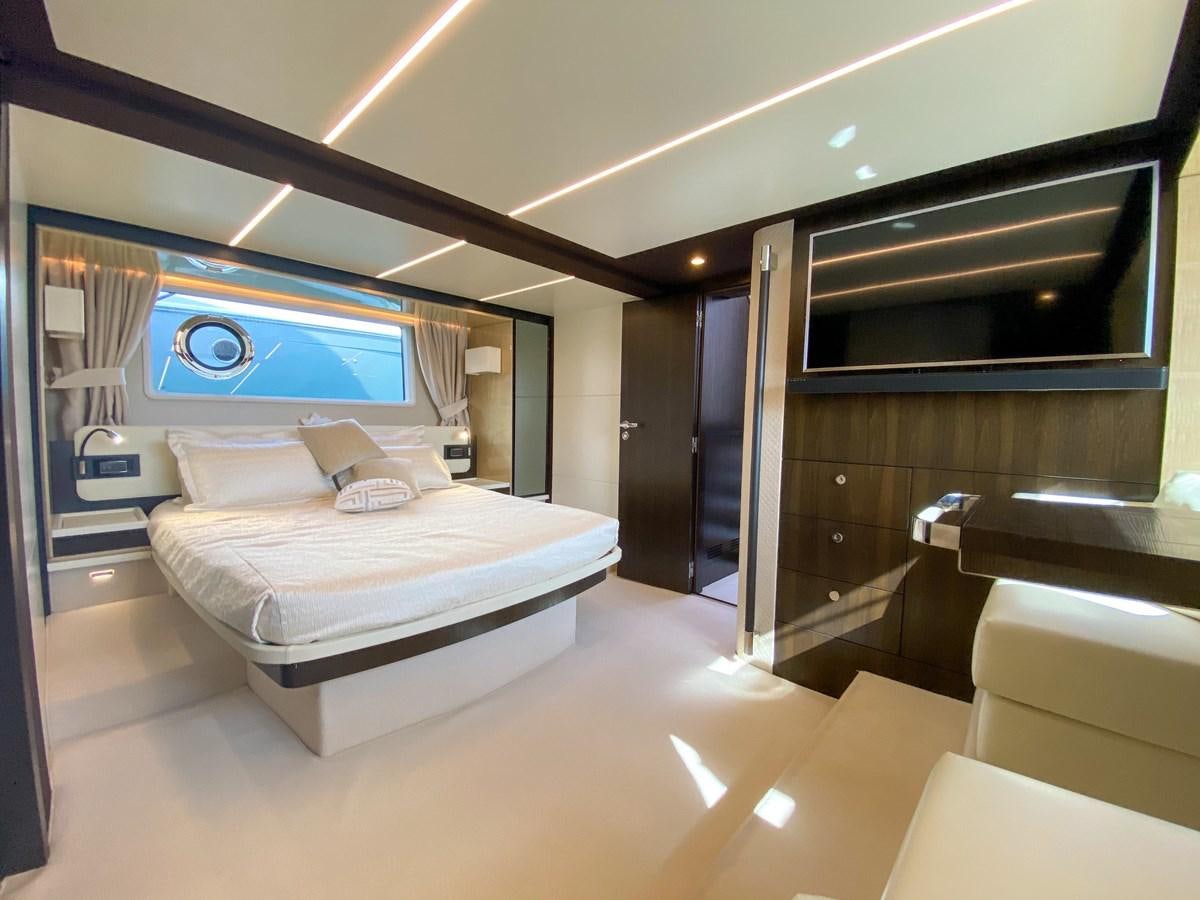 a room with a bed and a tv aboard CERULEAN Yacht for Sale