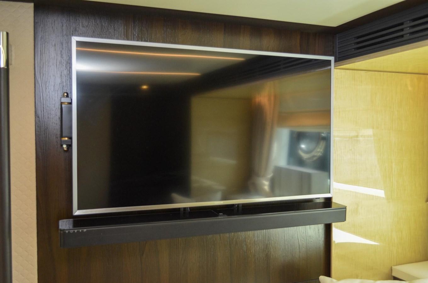 a tv on a wall aboard CERULEAN Yacht for Sale