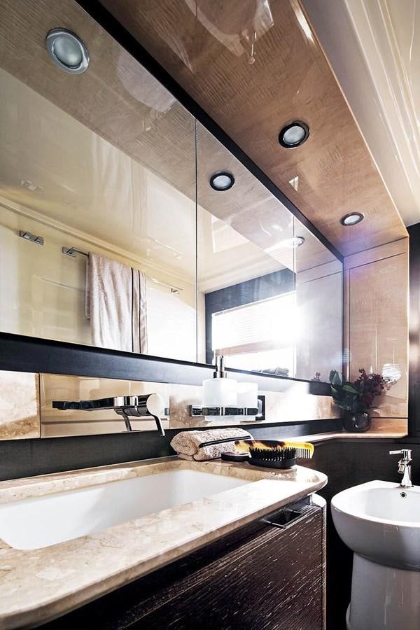 a bathroom with a large mirror aboard CERULEAN Yacht for Sale