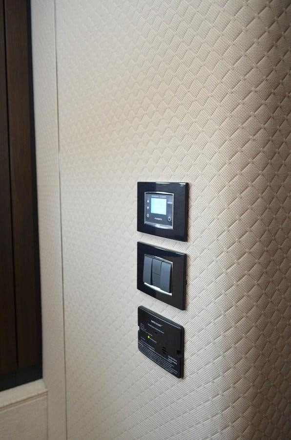 a couple of black rectangular electronic devices on a white surface aboard CERULEAN Yacht for Sale