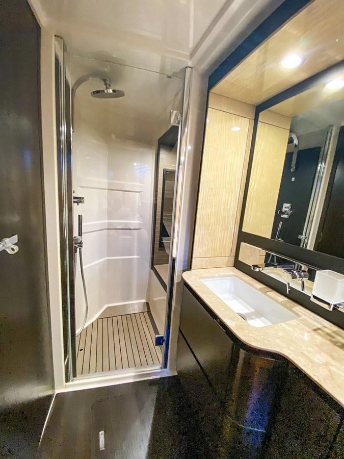 a bathroom with a glass shower aboard CERULEAN Yacht for Sale