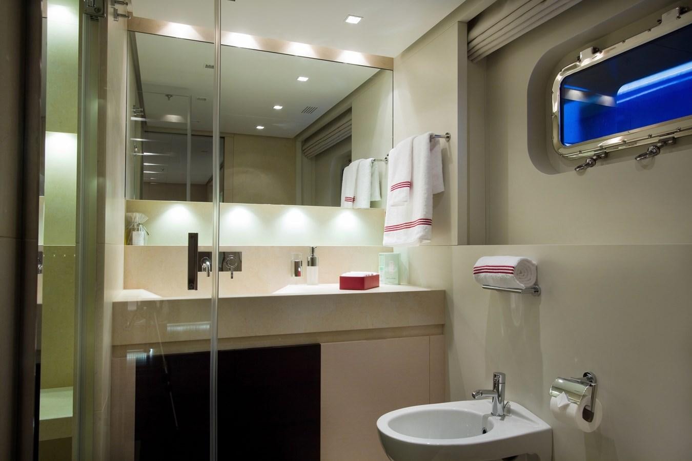 a bathroom with a large mirror aboard BURKUT Yacht for Sale