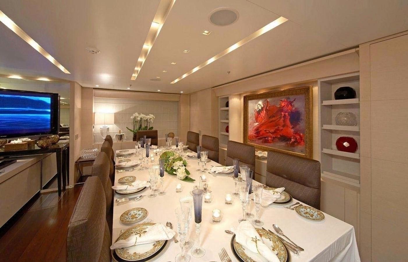 a dining room with a large screen aboard BURKUT Yacht for Sale