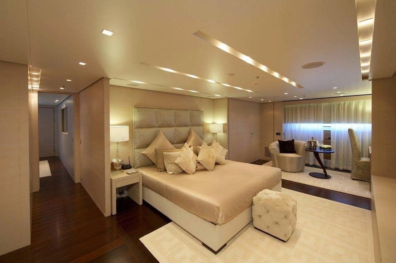 a large living room with a large bed and a large window aboard BURKUT Yacht for Sale