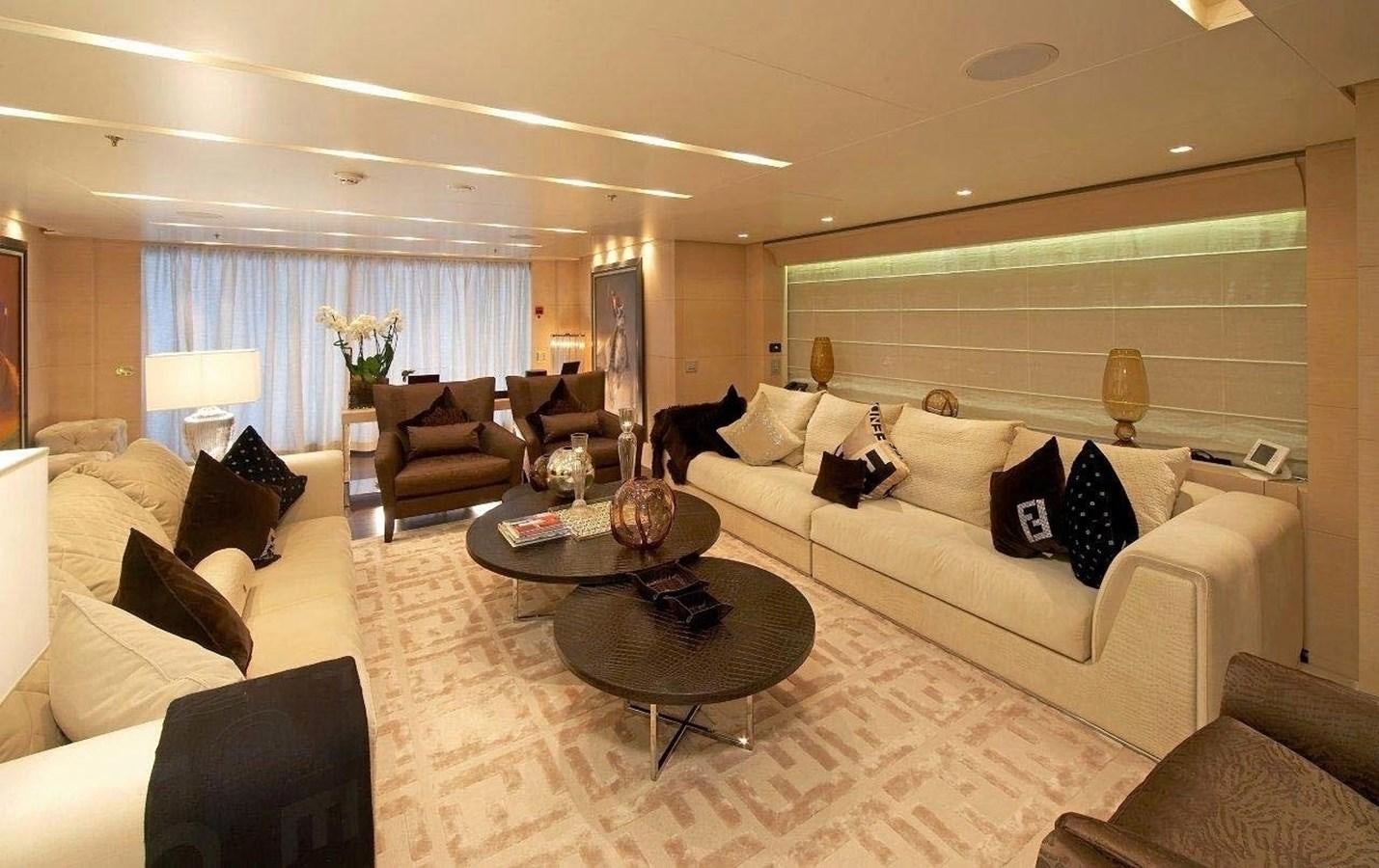 a living room with a large white couch and a table aboard BURKUT Yacht for Sale
