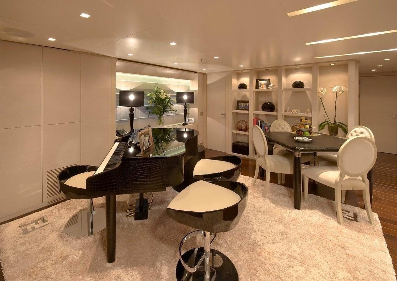 a room with tables and chairs aboard BURKUT Yacht for Sale