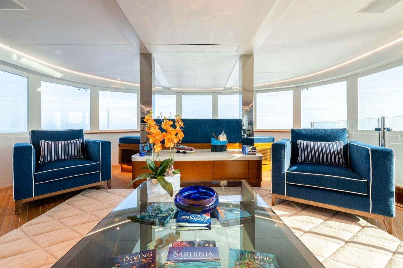 a living room with a couch and a table aboard WHITE STAR Yacht for Sale