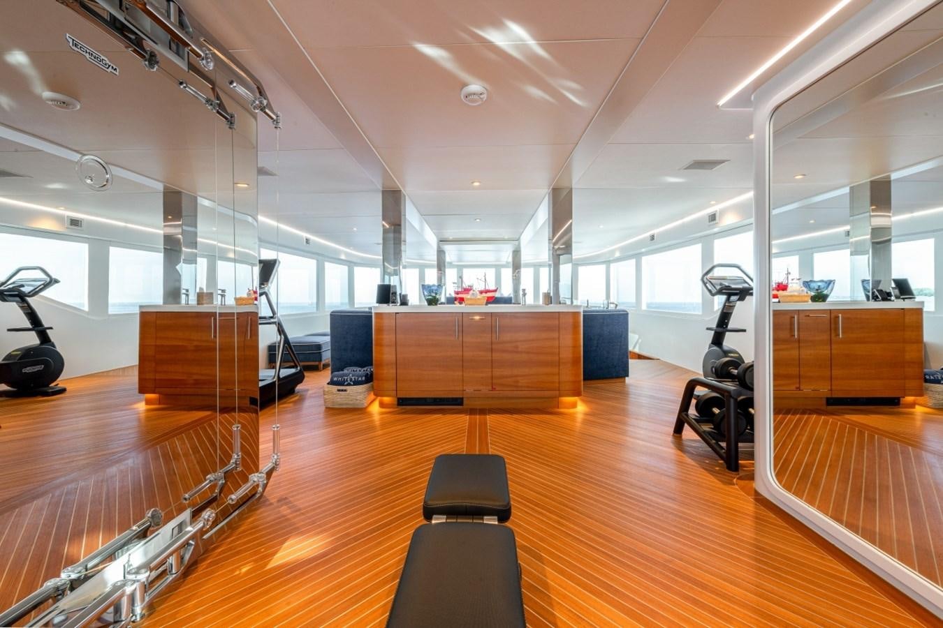 a gym with wooden floors aboard WHITE STAR Yacht for Sale