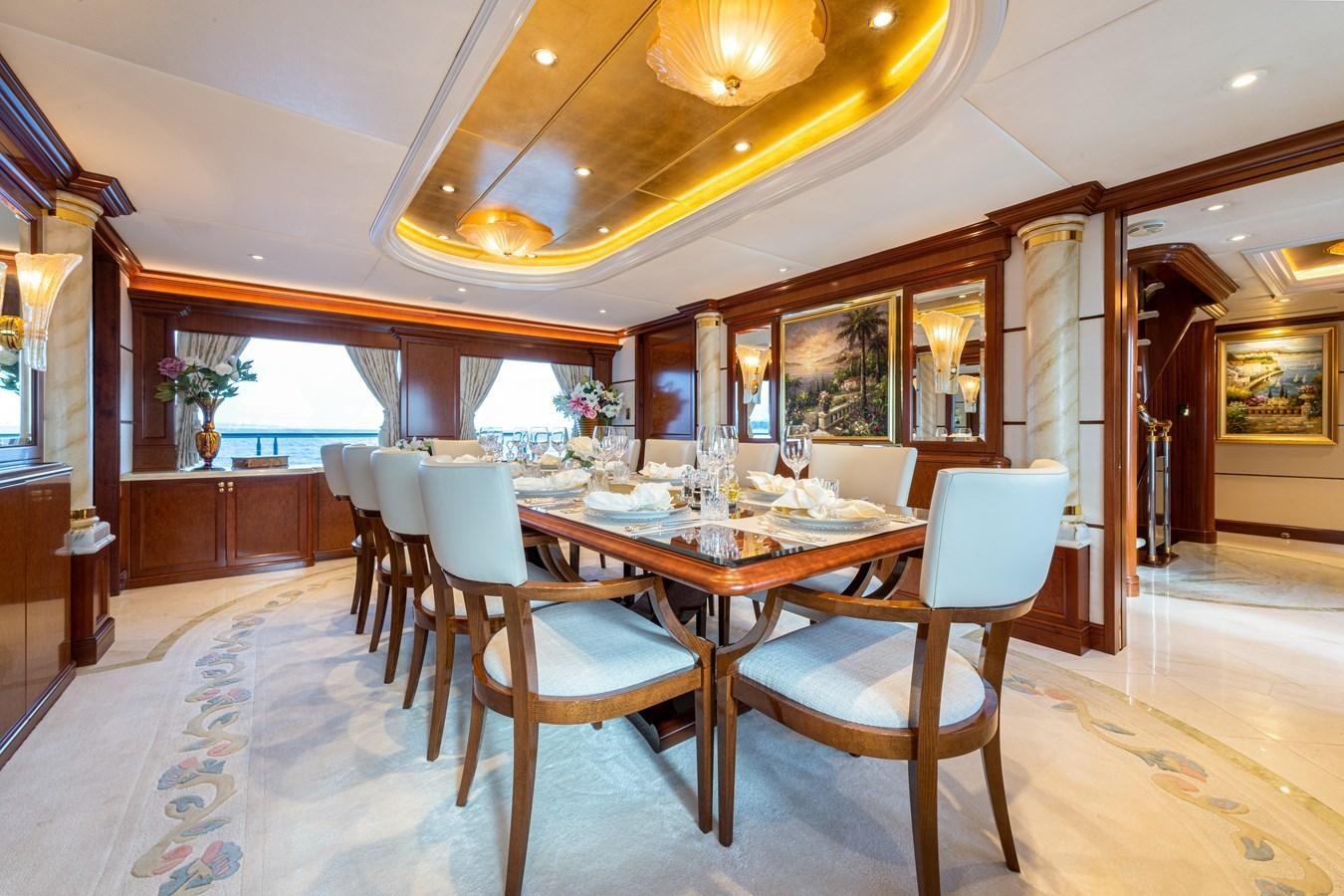 a dining room with a table and chairs aboard WHITE STAR Yacht for Sale