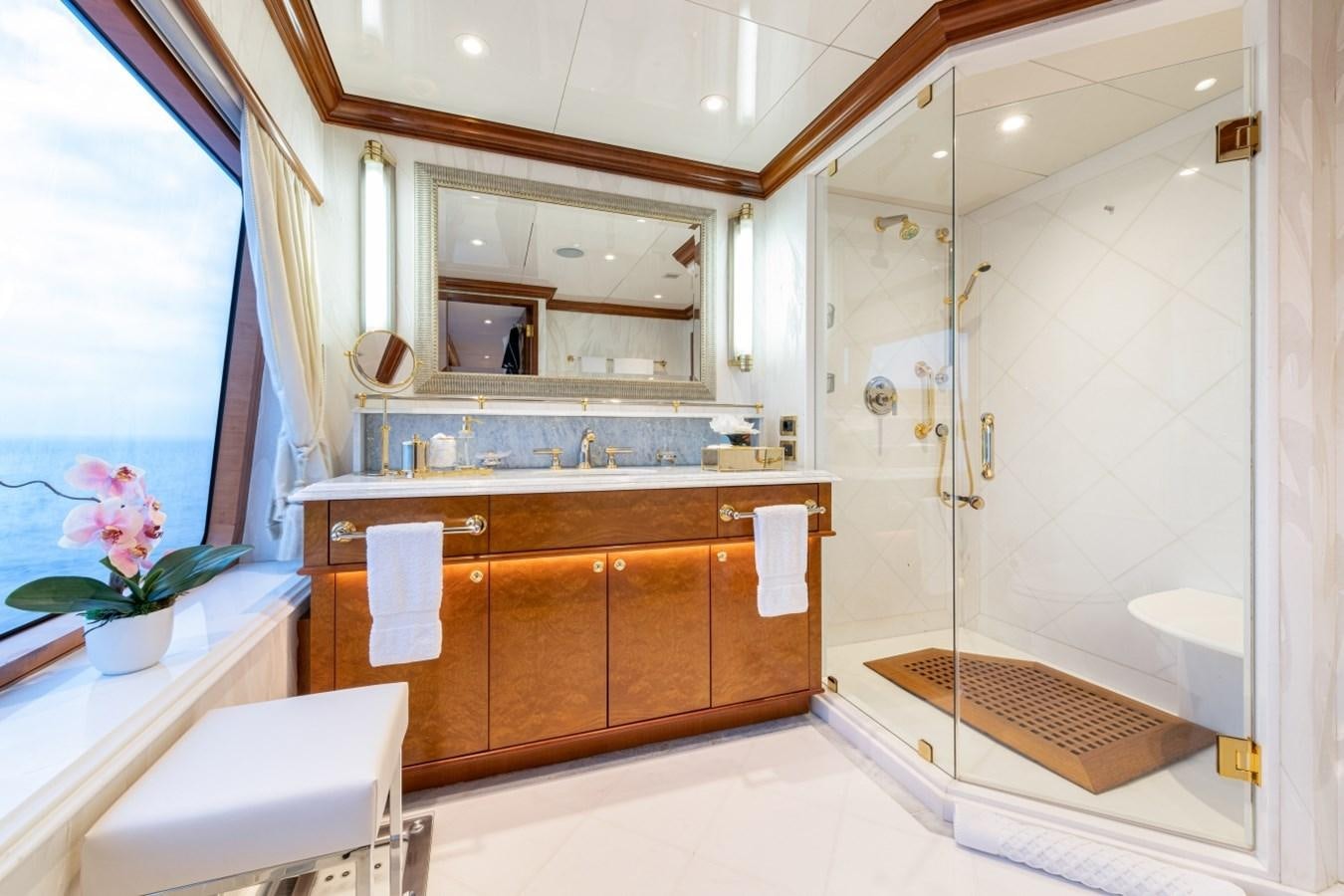 a bathroom with a glass shower aboard WHITE STAR Yacht for Sale