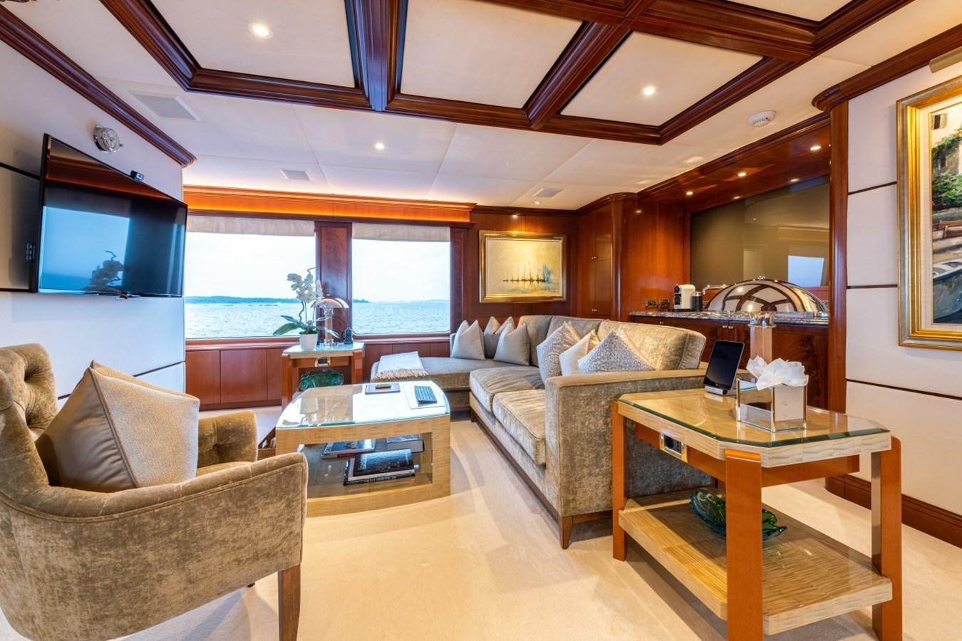 a living room with a couch and a coffee table aboard WHITE STAR Yacht for Sale