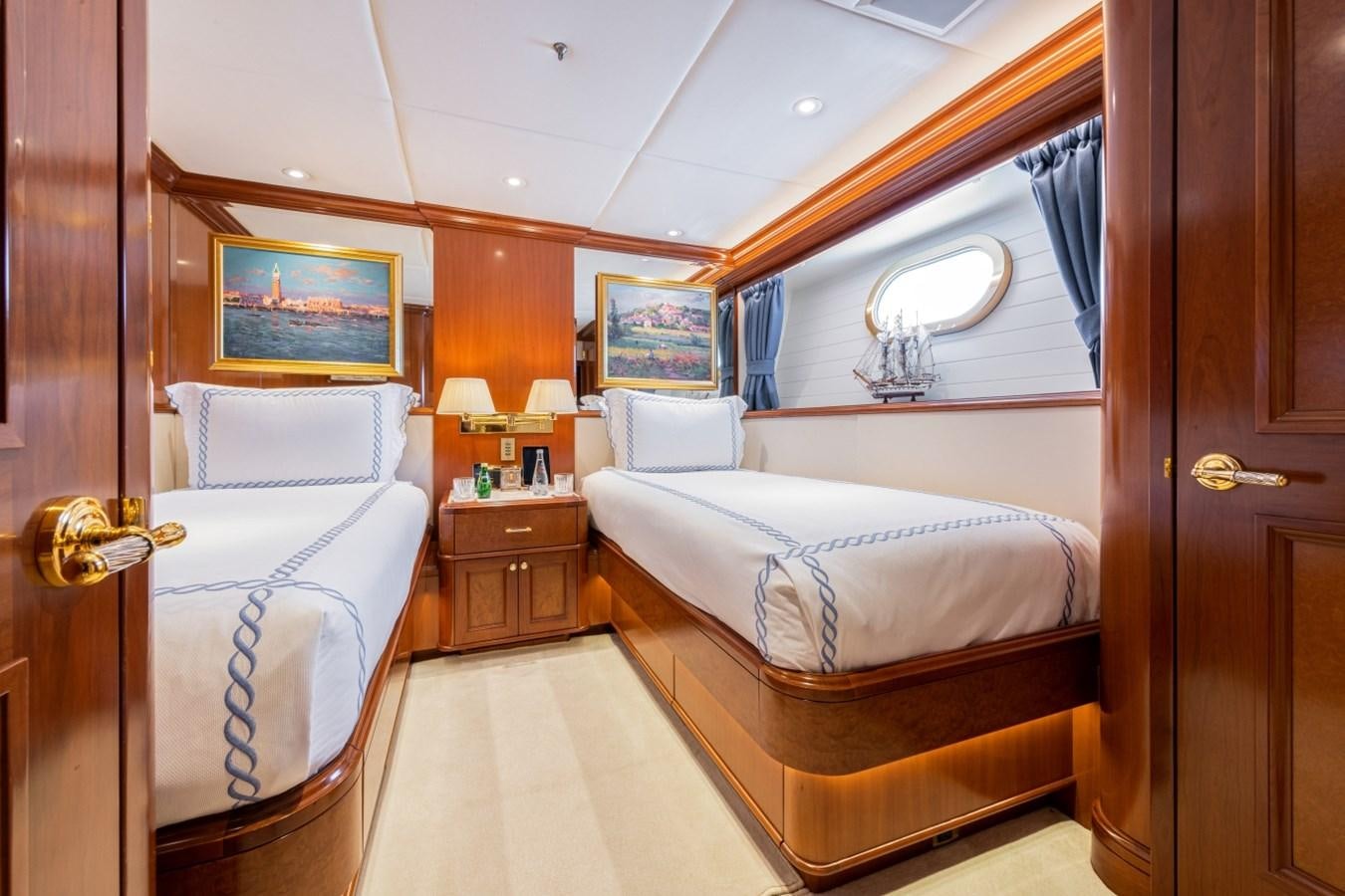 a bedroom with two beds aboard WHITE STAR Yacht for Sale