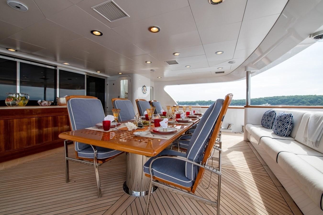 a large room with a table and chairs aboard WHITE STAR Yacht for Sale