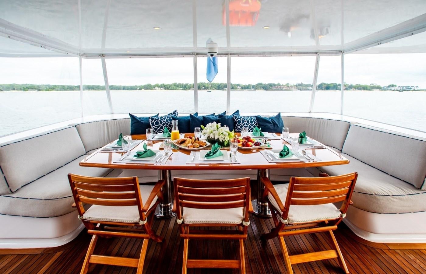 a dining table set for a meal aboard PACKAGE DEAL Yacht for Sale