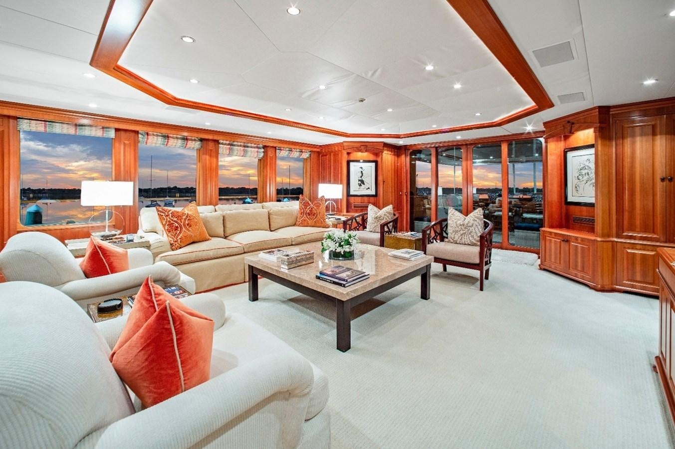 a living room with a table and chairs aboard PACKAGE DEAL Yacht for Sale