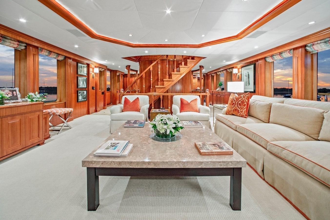 a living room with a table and couches aboard PACKAGE DEAL Yacht for Sale