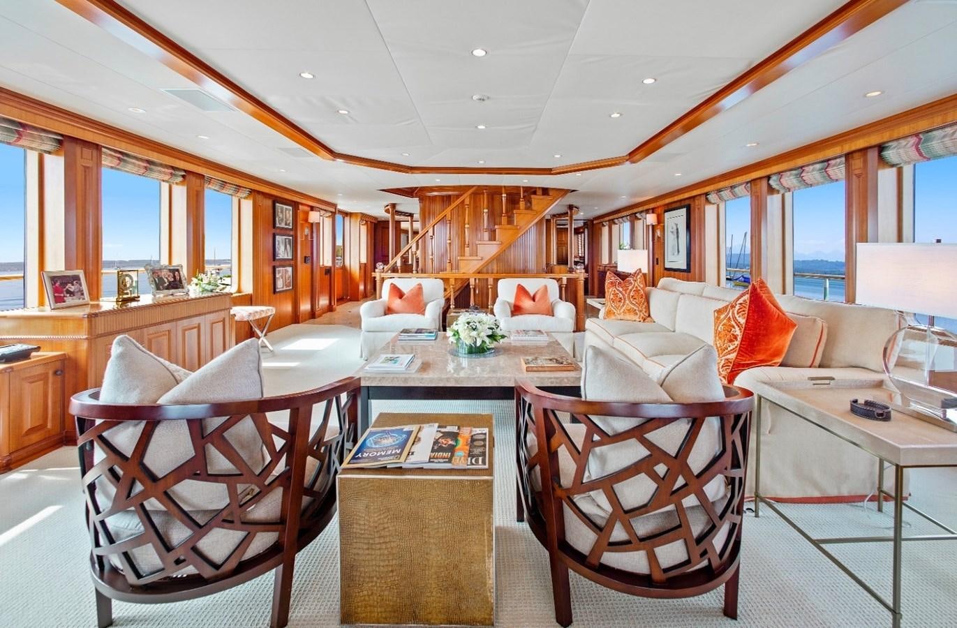 a living room with a table chairs and a window aboard PACKAGE DEAL Yacht for Sale