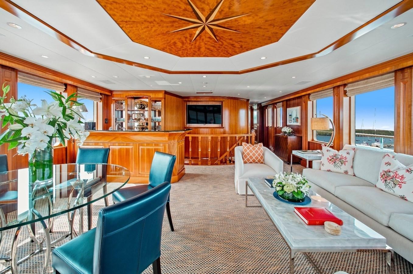 a living room with a table and chairs aboard PACKAGE DEAL Yacht for Sale