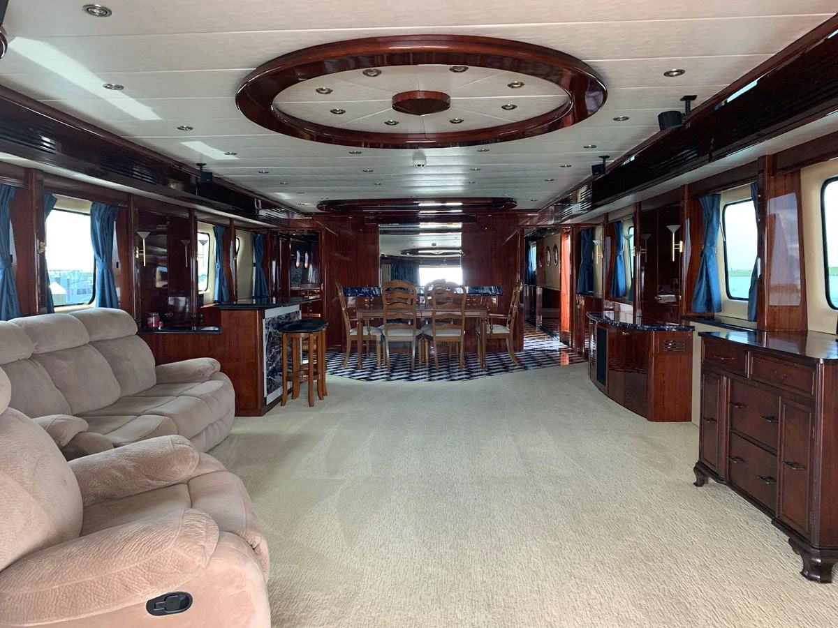 a room with a couch and a table and chairs aboard 117 BILGIN YACHTS 2007 Yacht for Sale