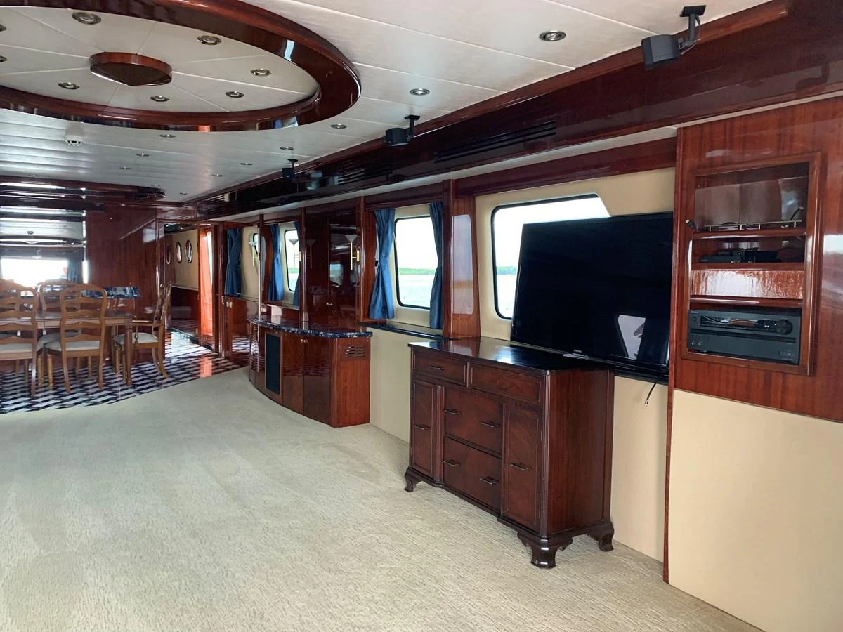 a room with a tv and chairs aboard 117 BILGIN YACHTS 2007 Yacht for Sale