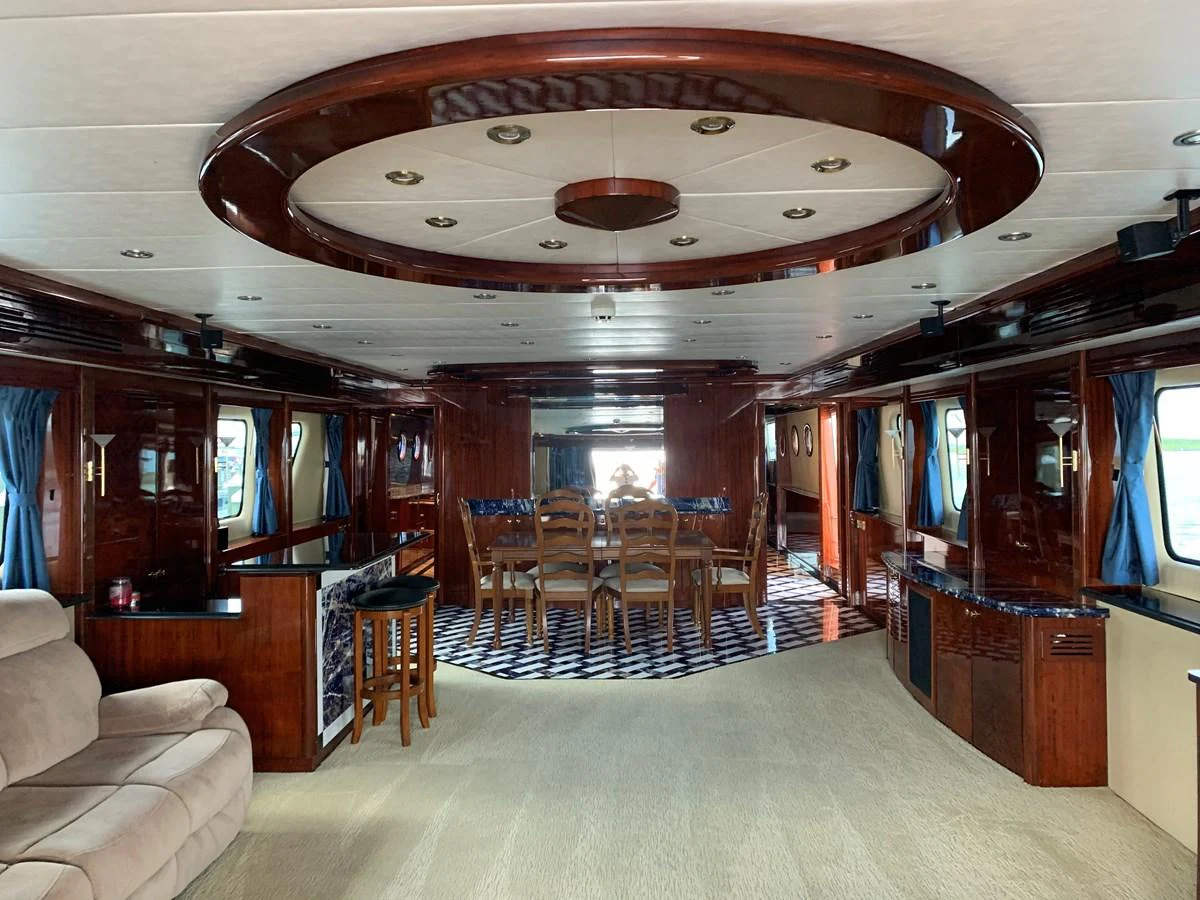 a large room with chairs and a chandelier aboard 117 BILGIN YACHTS 2007 Yacht for Sale