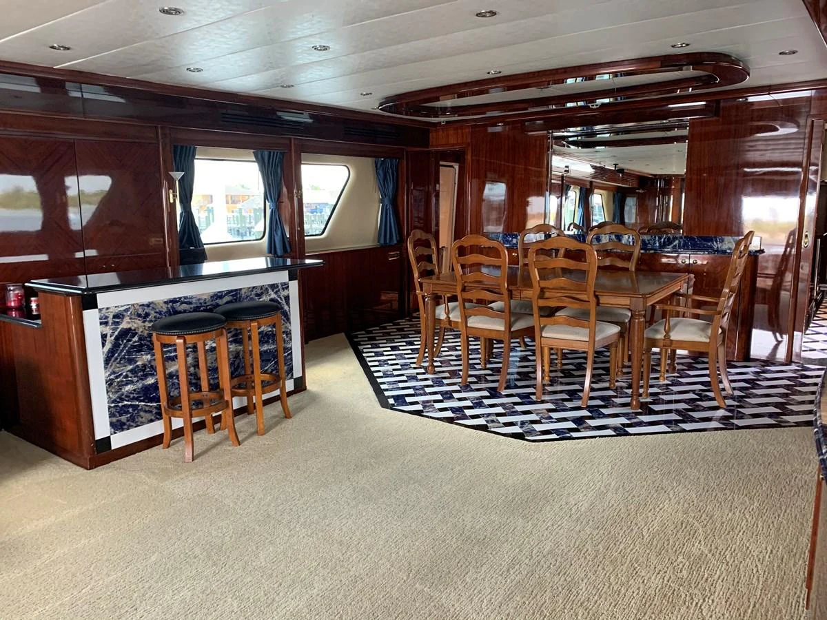 a room with a table and chairs aboard 117 BILGIN YACHTS 2007 Yacht for Sale