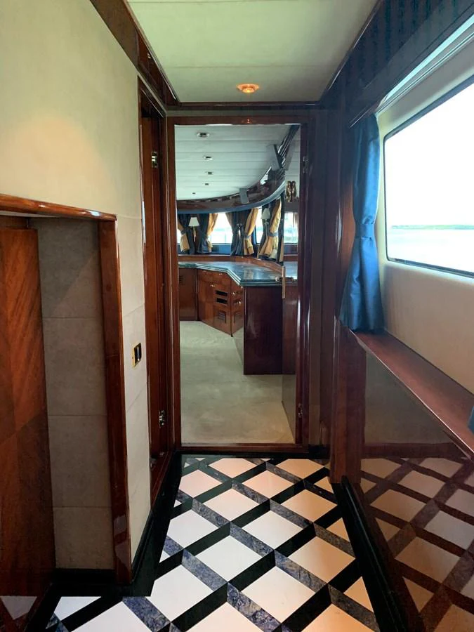 a hallway with a door and a window aboard 117 BILGIN YACHTS 2007 Yacht for Sale