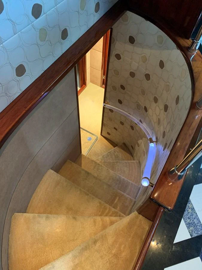 a staircase with a round window aboard 117 BILGIN YACHTS 2007 Yacht for Sale