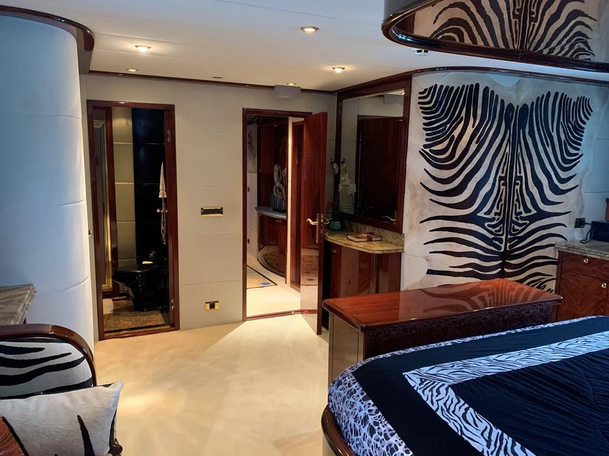 a bedroom with a bed and a desk aboard 117 BILGIN YACHTS 2007 Yacht for Sale