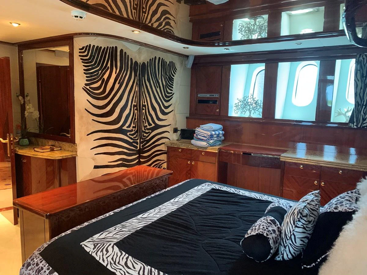 a bedroom with a bed and a desk aboard 117 BILGIN YACHTS 2007 Yacht for Sale