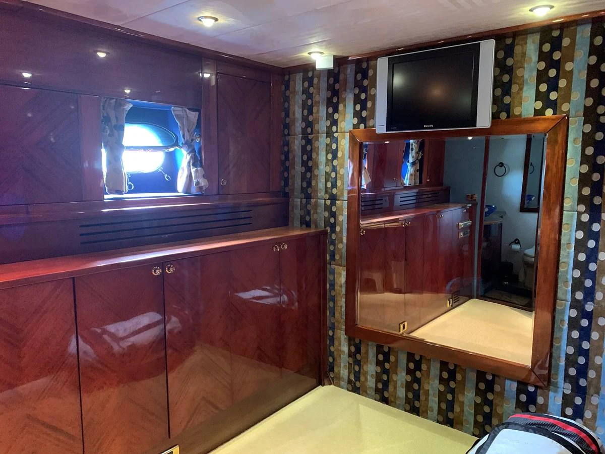 a room with a tv and a cabinet aboard 117 BILGIN YACHTS 2007 Yacht for Sale