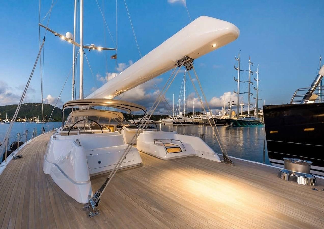 a boat docked at a pier aboard SPIIP Yacht for Sale