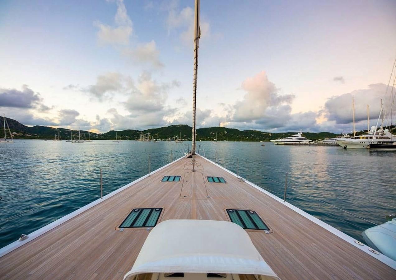 a dock with a sailboat on it aboard SPIIP Yacht for Sale