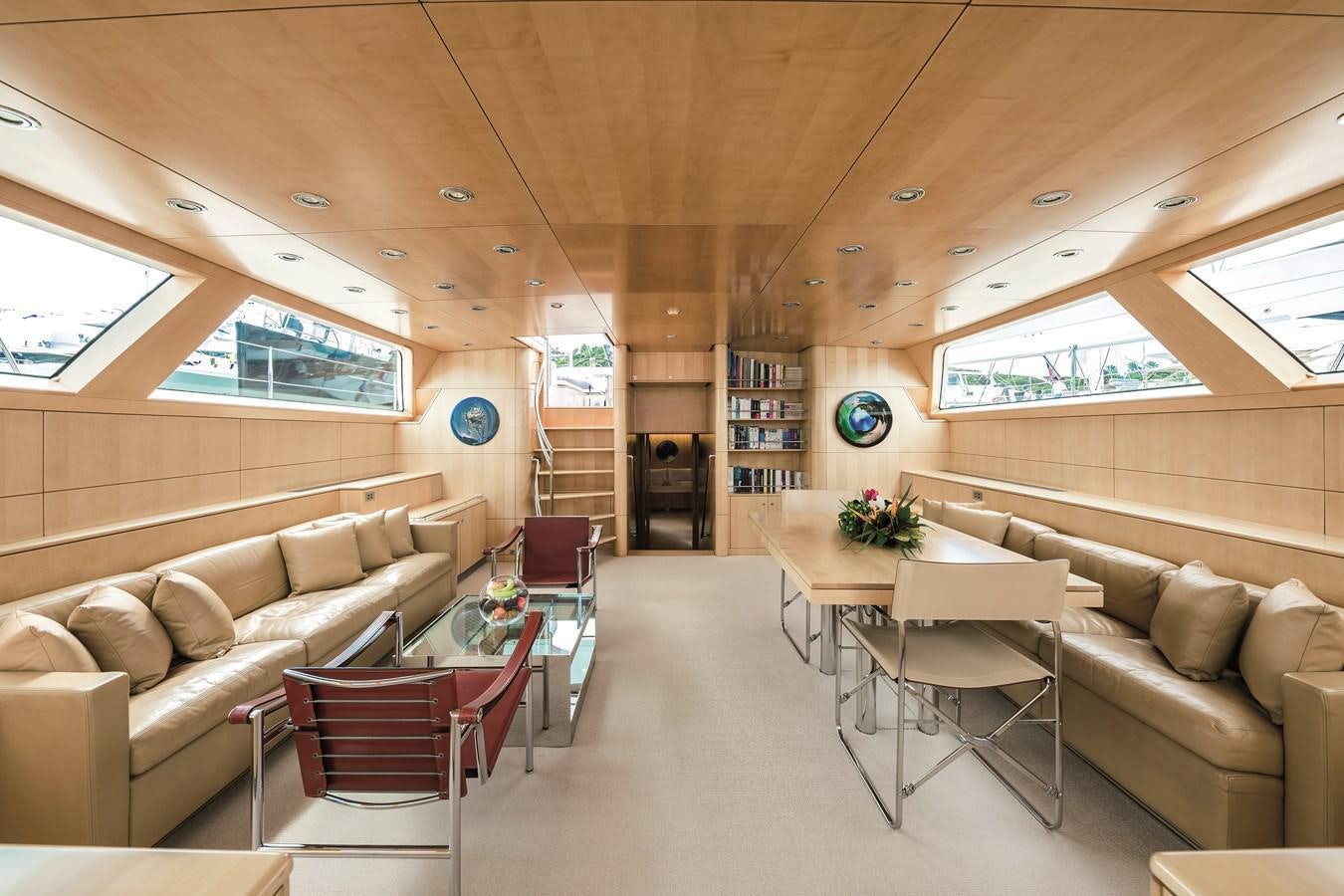 a living room with a couch and chairs aboard SPIIP Yacht for Sale