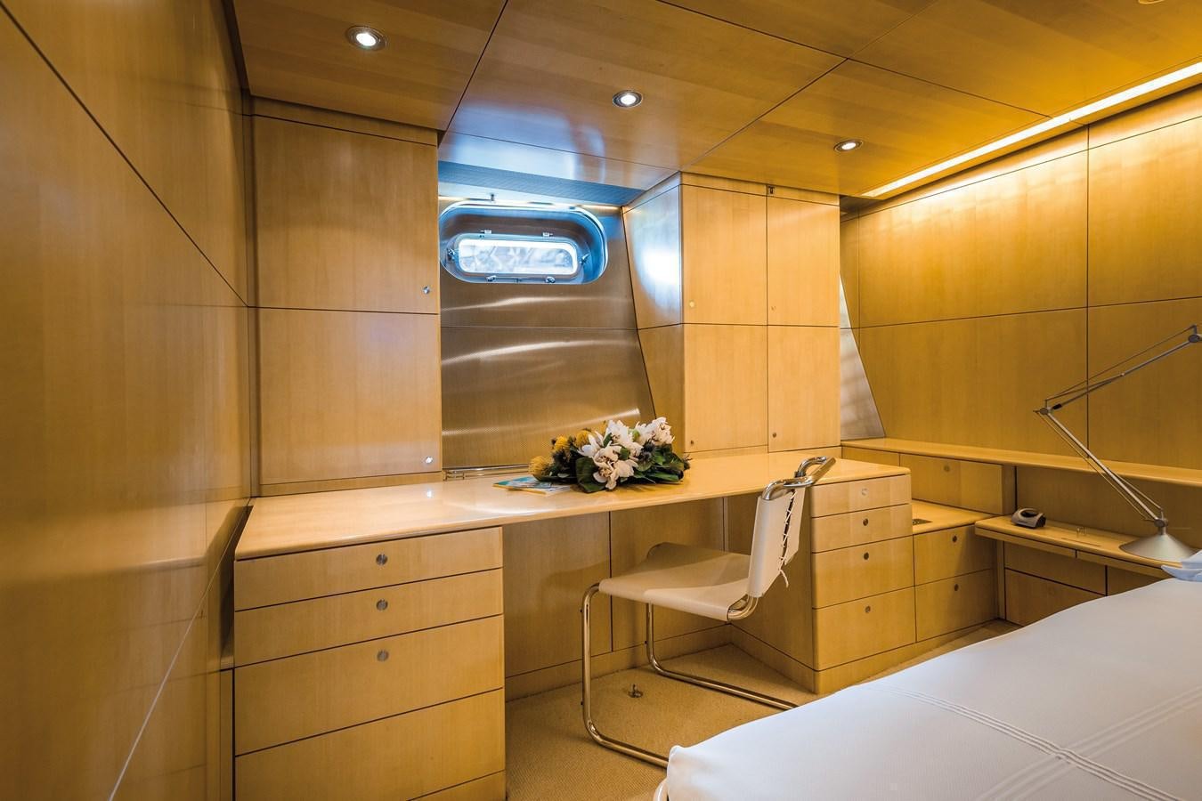 a room with a desk and a chair aboard SPIIP Yacht for Sale